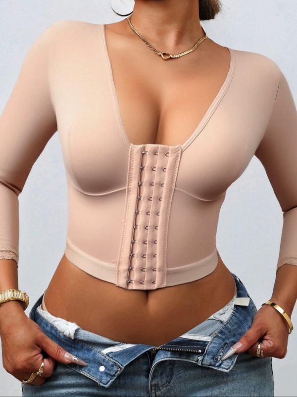 Haut gainant de compression pour femme : débardeur sculptant avec manches en dentelle, fermeture à l'avant et effet amincissant pour les bras.