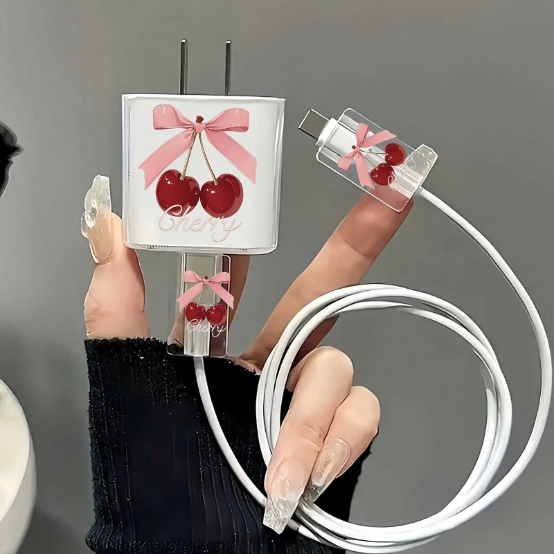 Kit de 3 accessoires pour chargeur iPhone : coque de protection transparente et mignonne (motif cerise et nœud) + décoration pour câble de données.